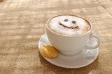 Coffee cappuccino with foam or chocolate smiling happy face