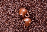 Background of coffee beans with cup 