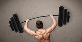 muscular man lifting weights 