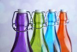 Colorful bottles on light background 