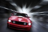 Luxury red sport car speeding in a underground parking 