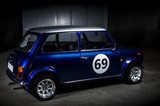 Iconic blue Mini Cooper in a parking area 