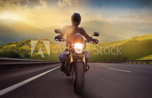 Man seat on the motorcycle on the mountain road