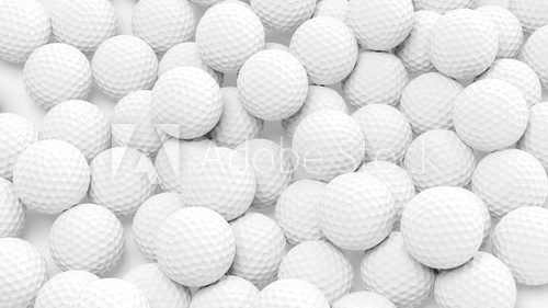 Many golf balls together closeup isolated on white