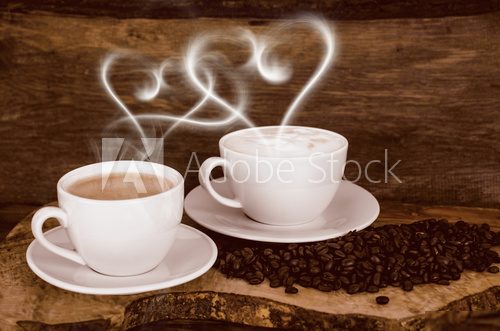 Coffee beans and coffee cup with heart- shaped steam