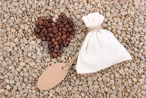 Sack with coffee on green coffee beans background