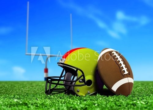 Football Ball and Helmet On Grass