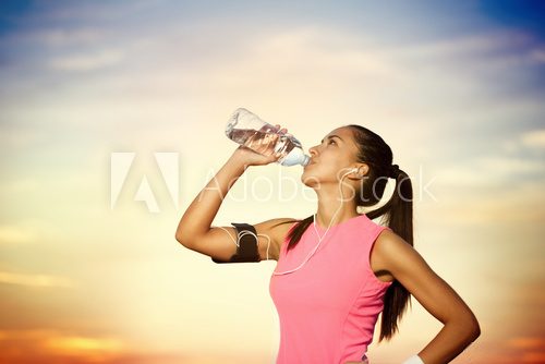 sporty girl  drinking water