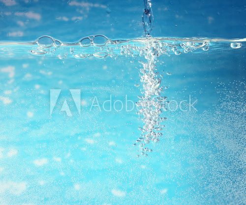 Bubbles in a blue water, close up