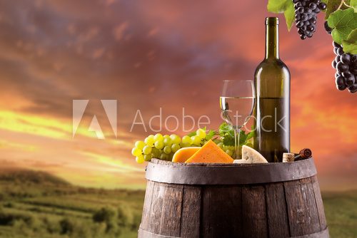 White wine with vineyard on background