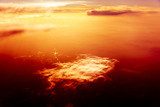 Red sky, sunset and  clouds. Flying over Clouds 