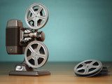 Video, cinema concept. Vintage film movie projector and reels on 