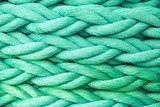 Green nautical rope, close-up background texture