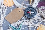 compass on fishing net with tag