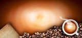 Coffee cup and coffee beans on a wooden table. Dark background