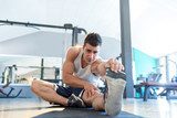 Male fitness model doing sit ups and crunches exercising abdomin