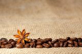Coffee and Star Anise on sackcloth background with copyspace 