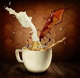 Coffee With Milk Splashing. Cup of Cappuccino or Latte 