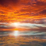 Reflection of Beautiful Sunset /  Majestic Clouds and Sun above 