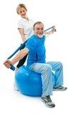 Senior man doing fitness exercise with help of trainer 