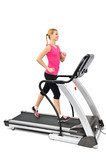 young woman doing exercises on treadmill 