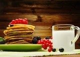 Healthy breakfast with pancakes, fresh berries and milk 