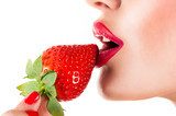 sexy woman eating strawberry, sensual red lips 