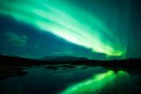 Northern lights above lagoon in Iceland 