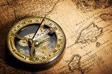 old compass on vintage map 