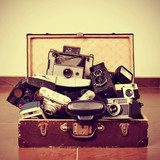 old cameras in an old suitcase 