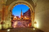 Green gate view for city hall of Gdansk at night, Poland 