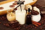 Beautiful chocolate spa setting on wooden table close-up 