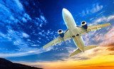 Airplane transportation. Jet air plane flies in blue sky 