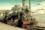 Old steam locomotive at station 