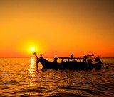 Boat in the sunset near Koh Phi Phi of Thailand 