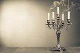 Vintage candelabrum with five reek candles sepia photo 