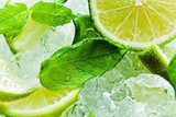 lime pieces and leaves of mint with ice 