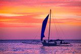 Sailing boat in the beautiful sunset. 