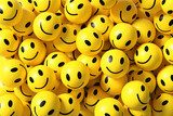 Many yellow emoticons with happy faces smiling and conveying joy