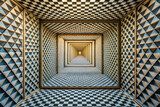 mesmerizing geometric illusion of depth featuring series of repeating patterns and textures. intricate design creates captivating visual experience that draws viewer in