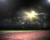 Nocna scena na lekkoatletycznym torze