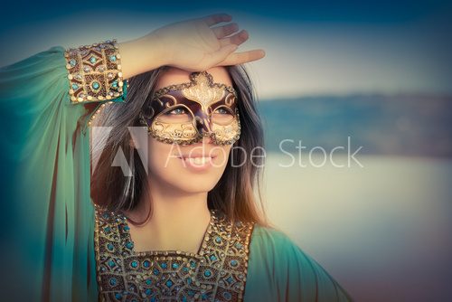 Young Woman Wearing Mask  and Oriental Dress