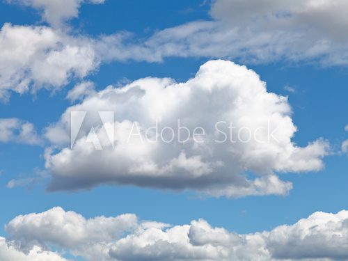 fluffy cloud in blue afternoon sky