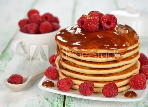Pancakes with caramel sauce and raspberries