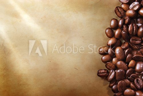Coffee beans on grunge paper background