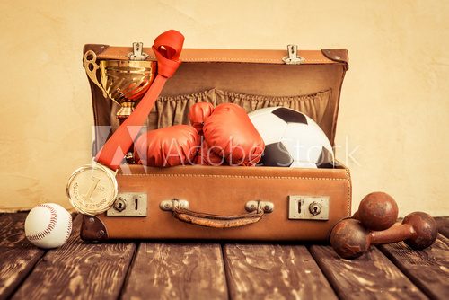 Vintage sport items in suitcase