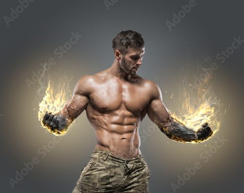 Handsome power athletic man bodybuilder.