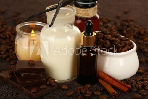 Beautiful chocolate spa setting on wooden table close-up