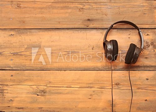 stylish headphones on a grungy wooden table