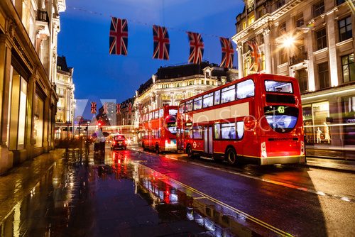 Red Bus on the Rainy Street of London in the Night, United Kingd
